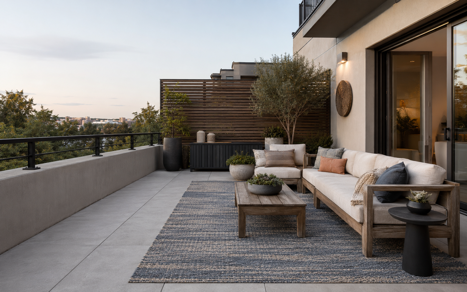 Balcony and patio decor ideas with teak seating, an outdoor rug, planters, storage and a privacy screen