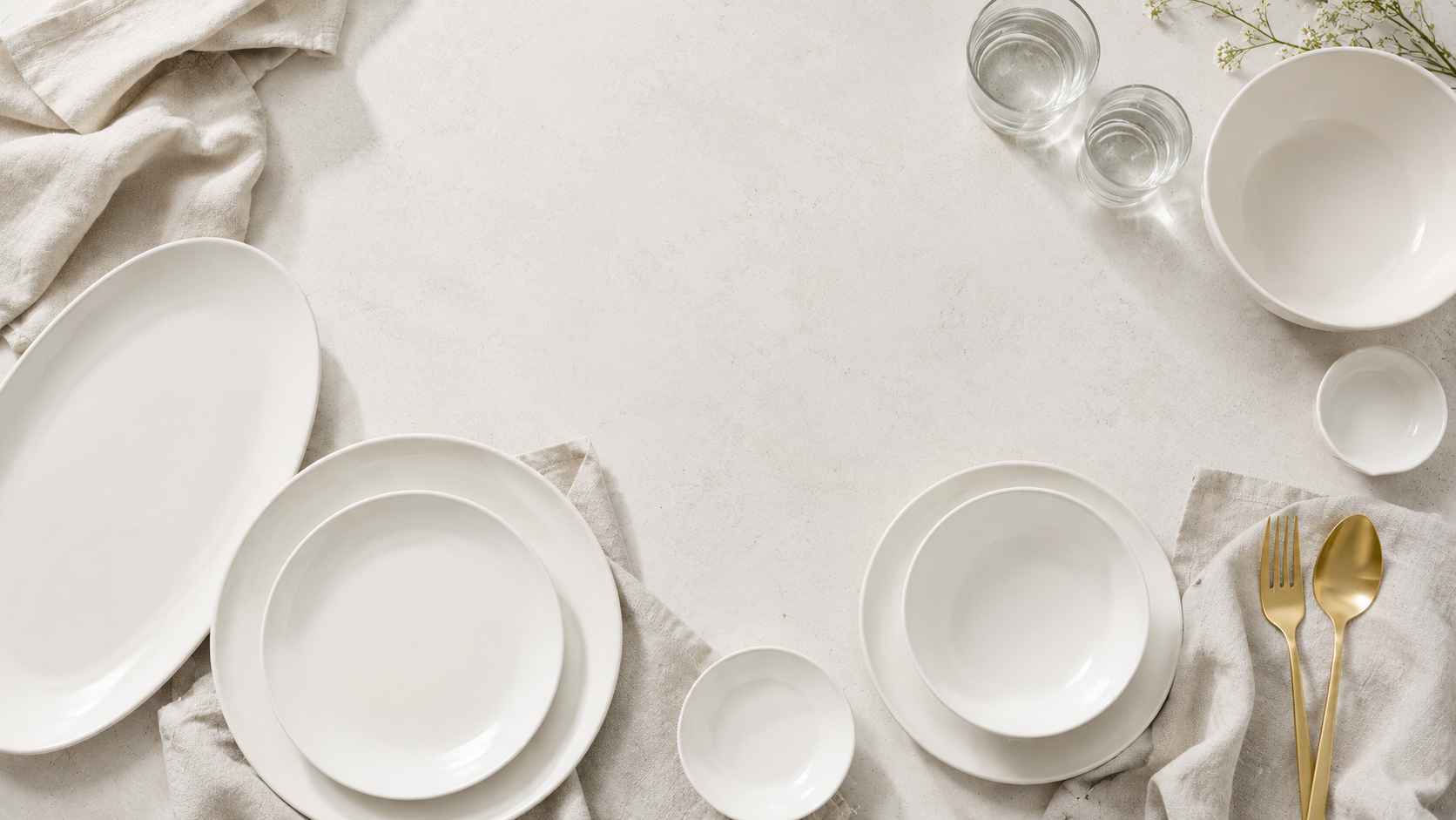 Neutral dinnerware and serveware product board with ivory plates bowls serving platter and glass accents