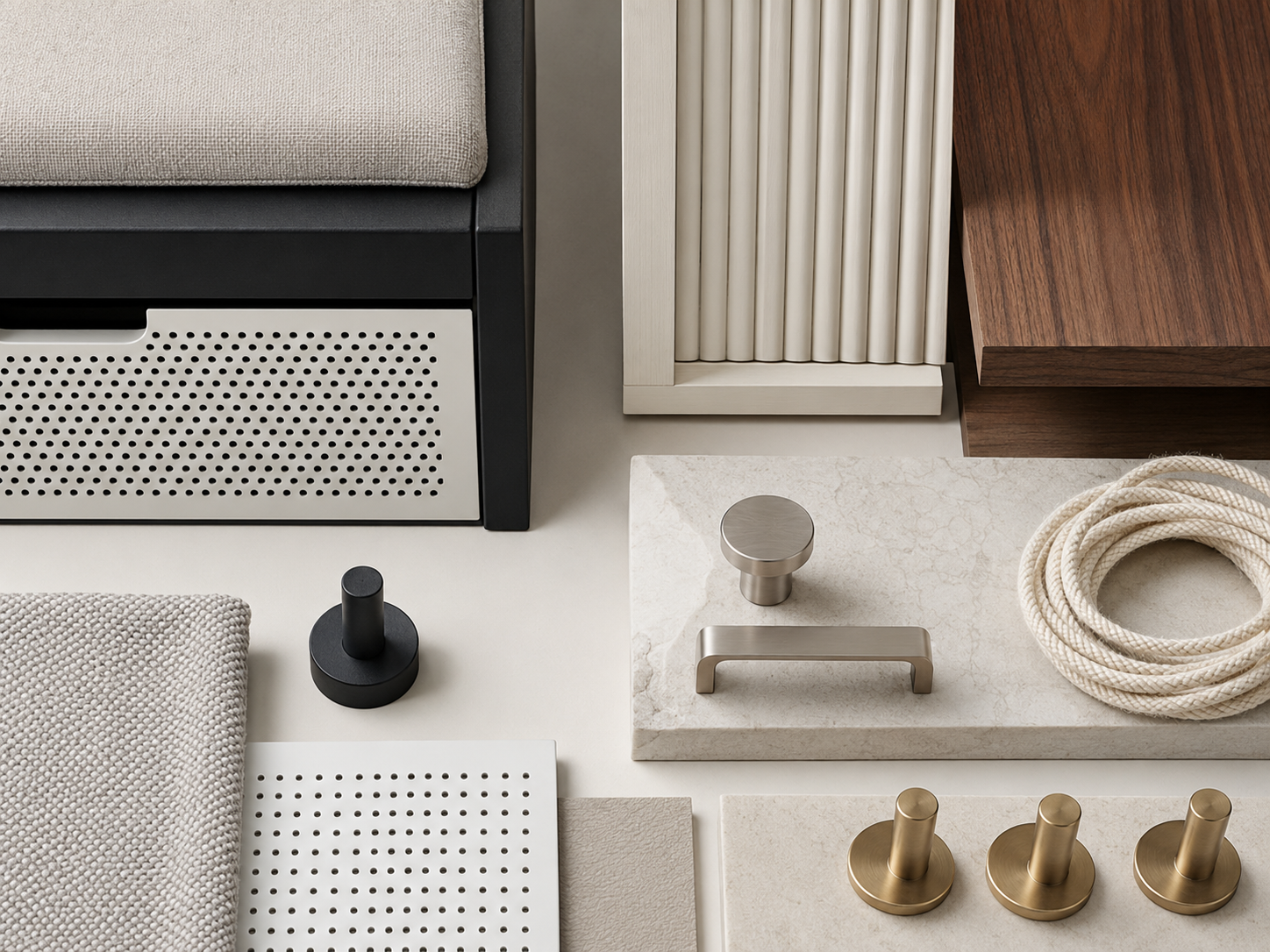Entryway material samples featuring neutral fabric, fluted wood, black metal, nickel hardware and woven rope
