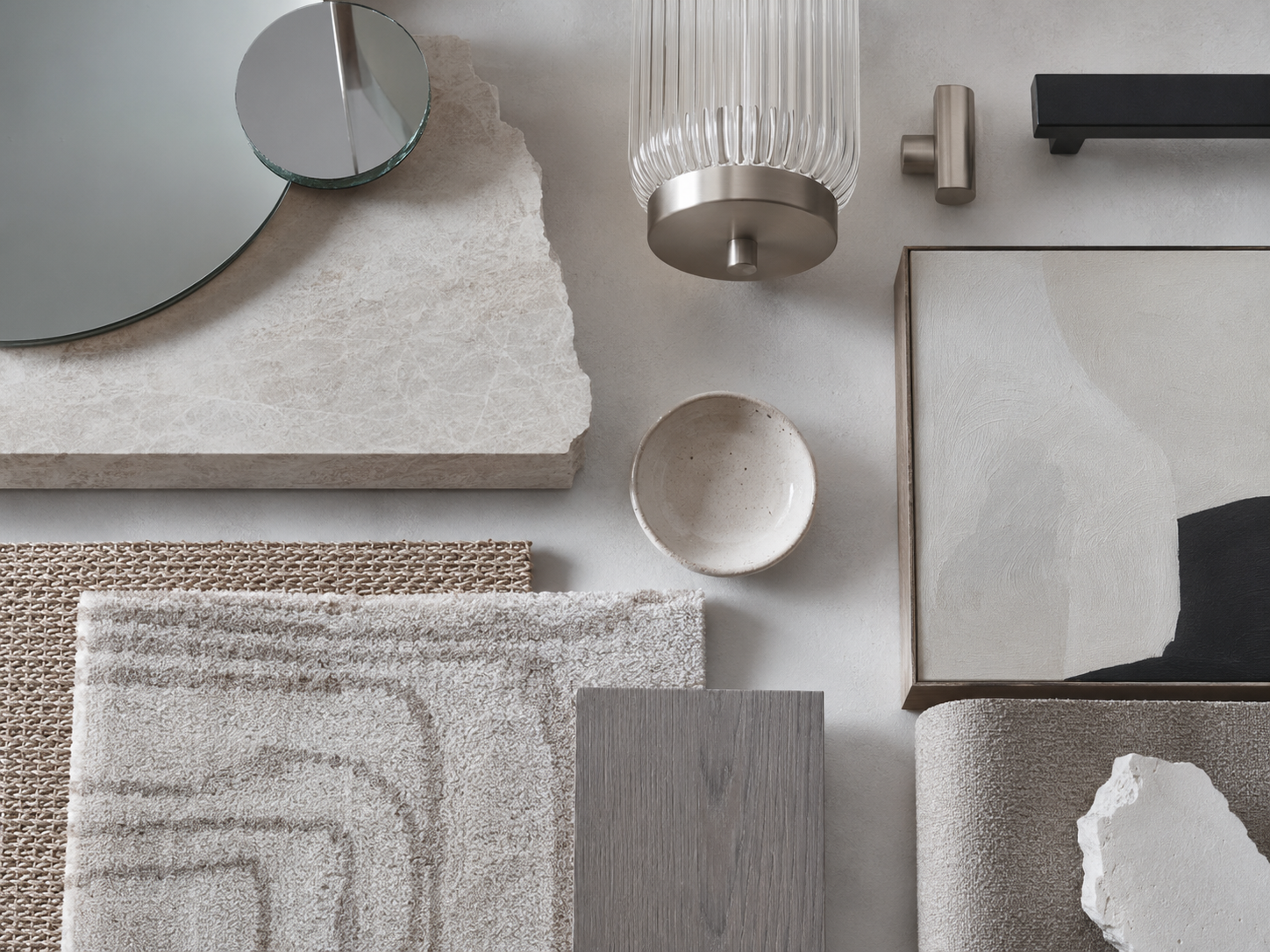 Entryway style moodboard with stone, mirror, fluted glass, woven rug, ceramic, upholstery and metal samples