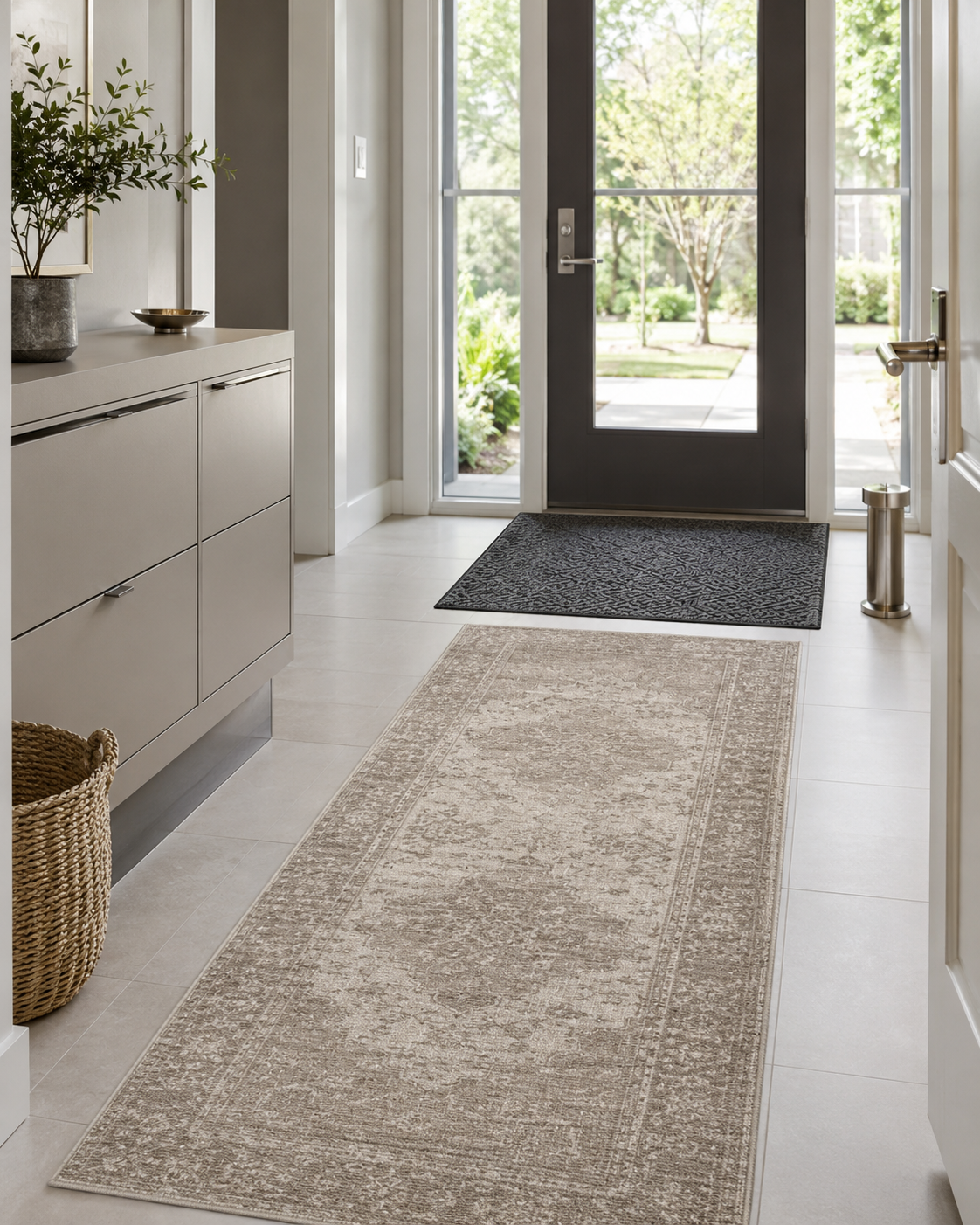 Family entryway with a washable neutral runner, charcoal mat and shoe cabinet