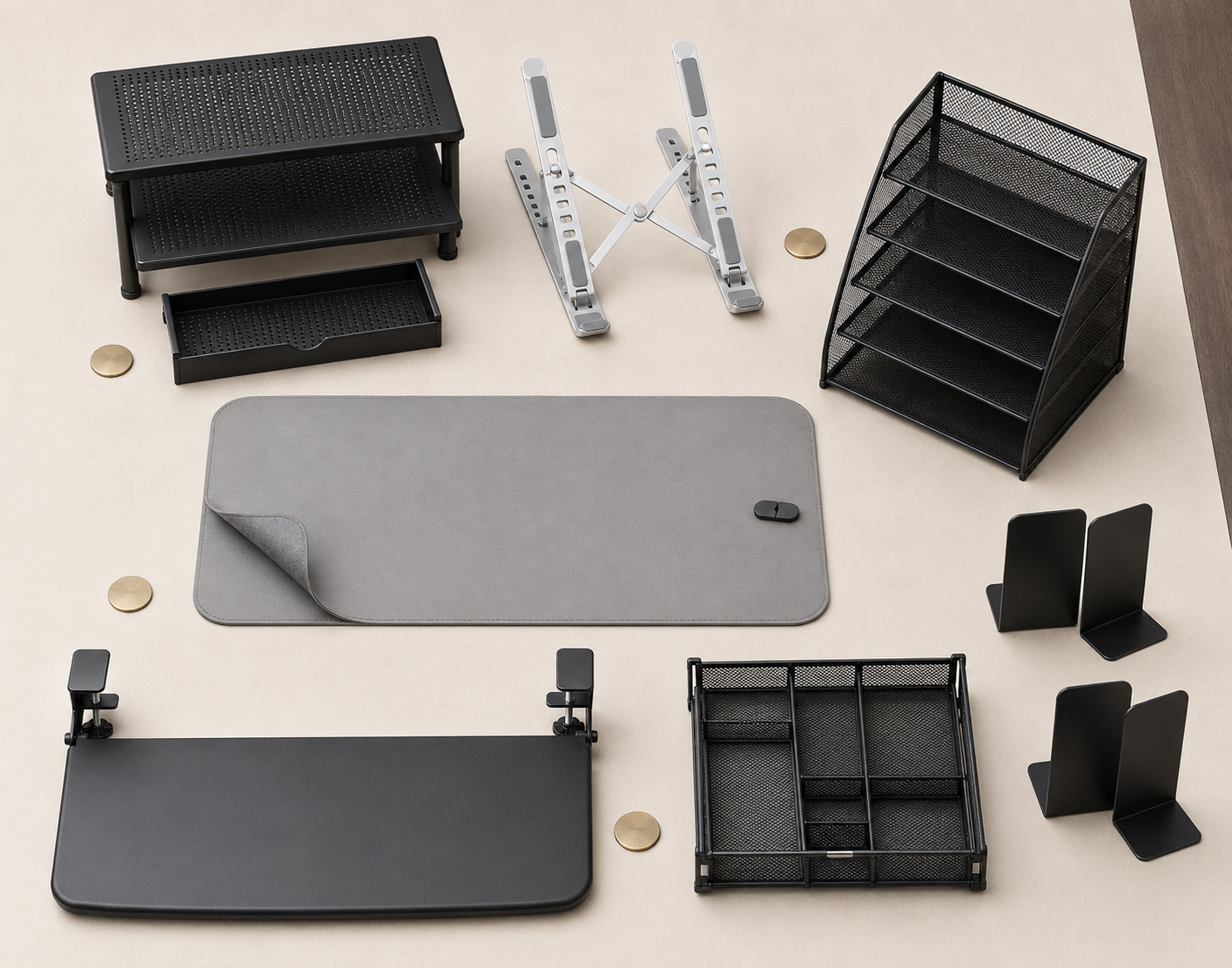 Flat-lay moodboard of laptop stands, a desk mat, paper trays, drawer organizer, keyboard tray and bookends.
