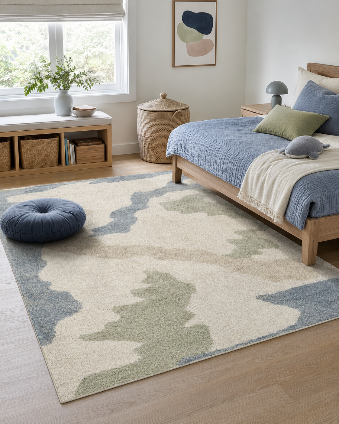 Large neutral kids room rug anchoring a pale oak bed and open play zone