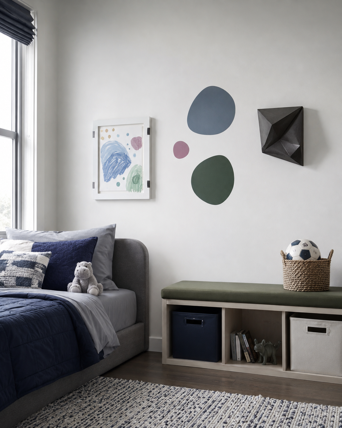Calm modern kids wall with framed artwork, changing display pieces and restrained personal details.