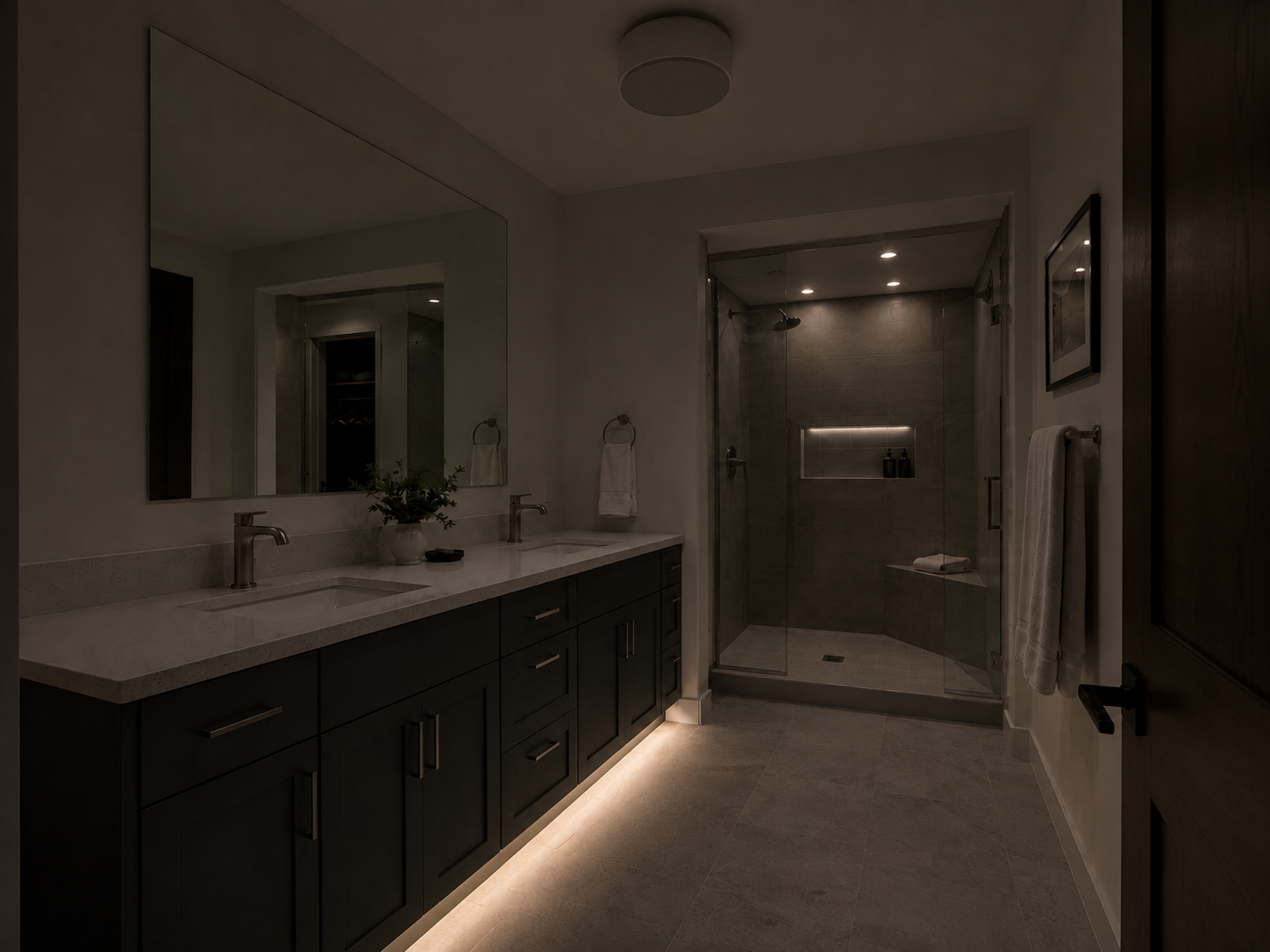 Bathroom at night using subtle low-level lighting instead of full vanity illumination