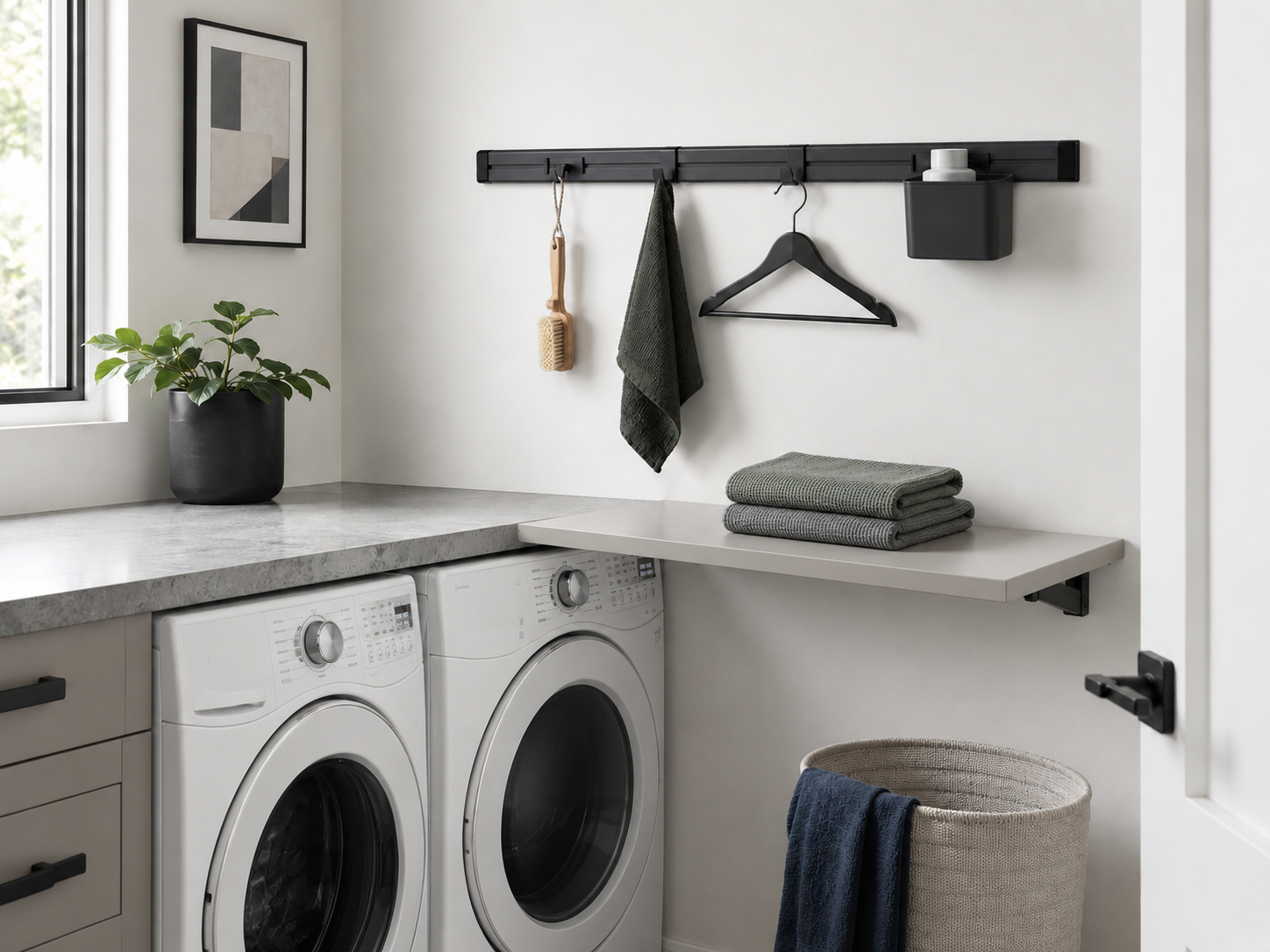 Small Laundry Room Solutions - Ravnora Decor Compact laundry room with the wall-mounted folding surface opened into a temporary laundry worktop.