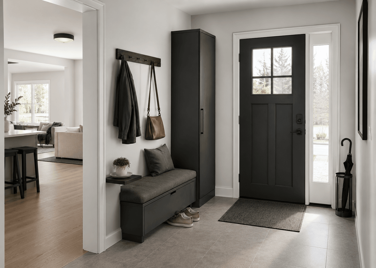 Contemporary entryway with closed storage, bench, wall hooks, shoes and umbrella storage arranged around a clear walking path.