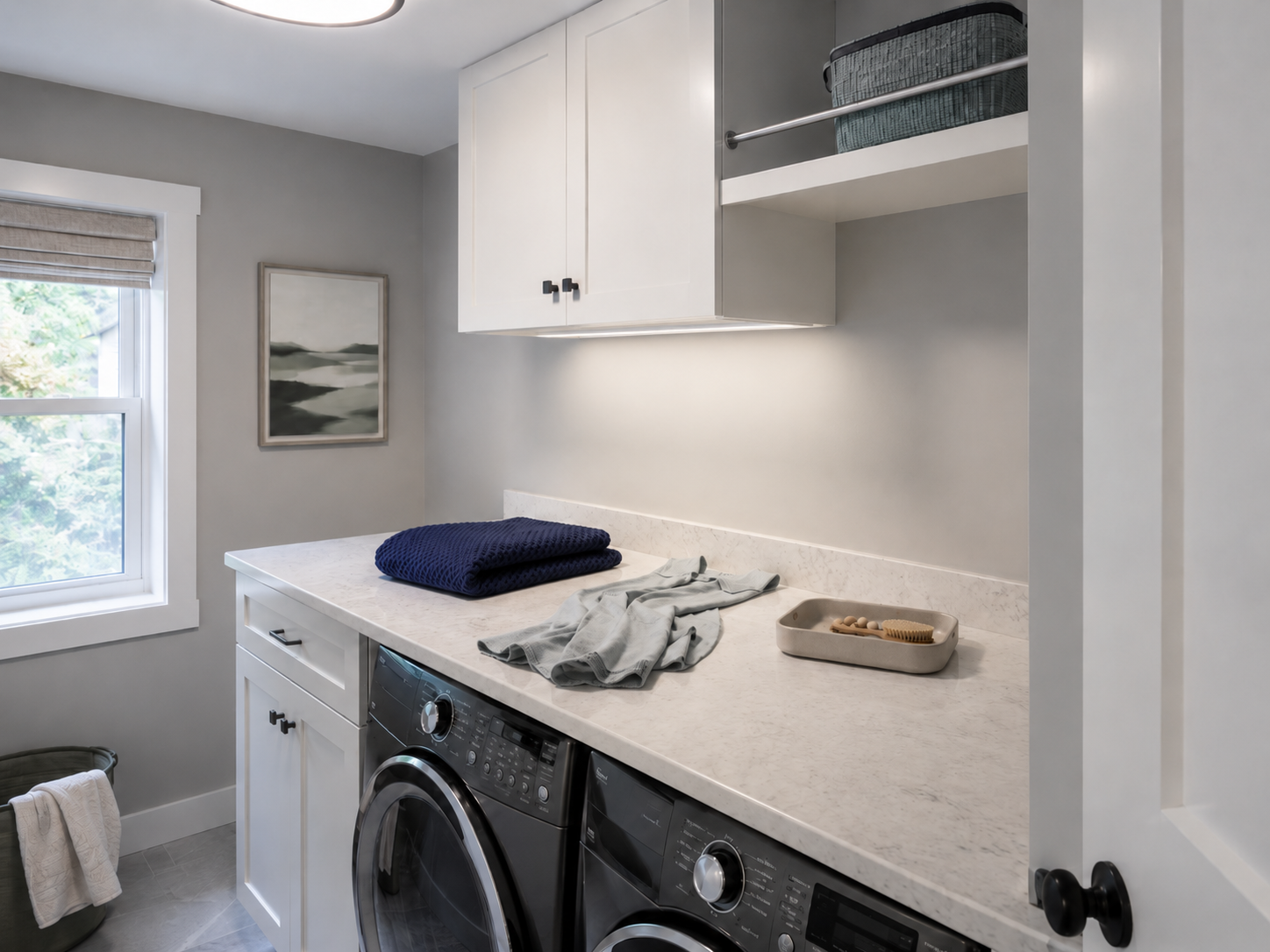 Same laundry counter illuminated by a task light installed after the upper cabinet blocks the ceiling light.