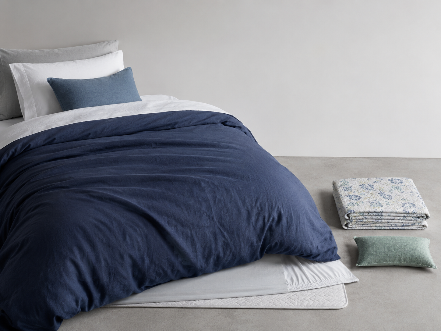 Layer and color balance example with a dominant blue cover, one patterned secondary textile and a repeated sage accent.