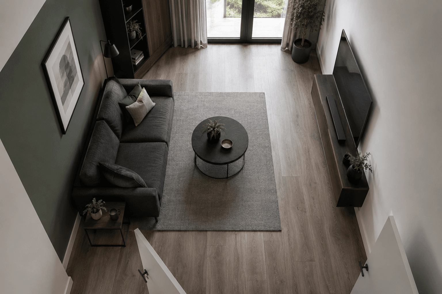 Overhead compact living room showing the sofa, centre table, media wall and clear circulation route.