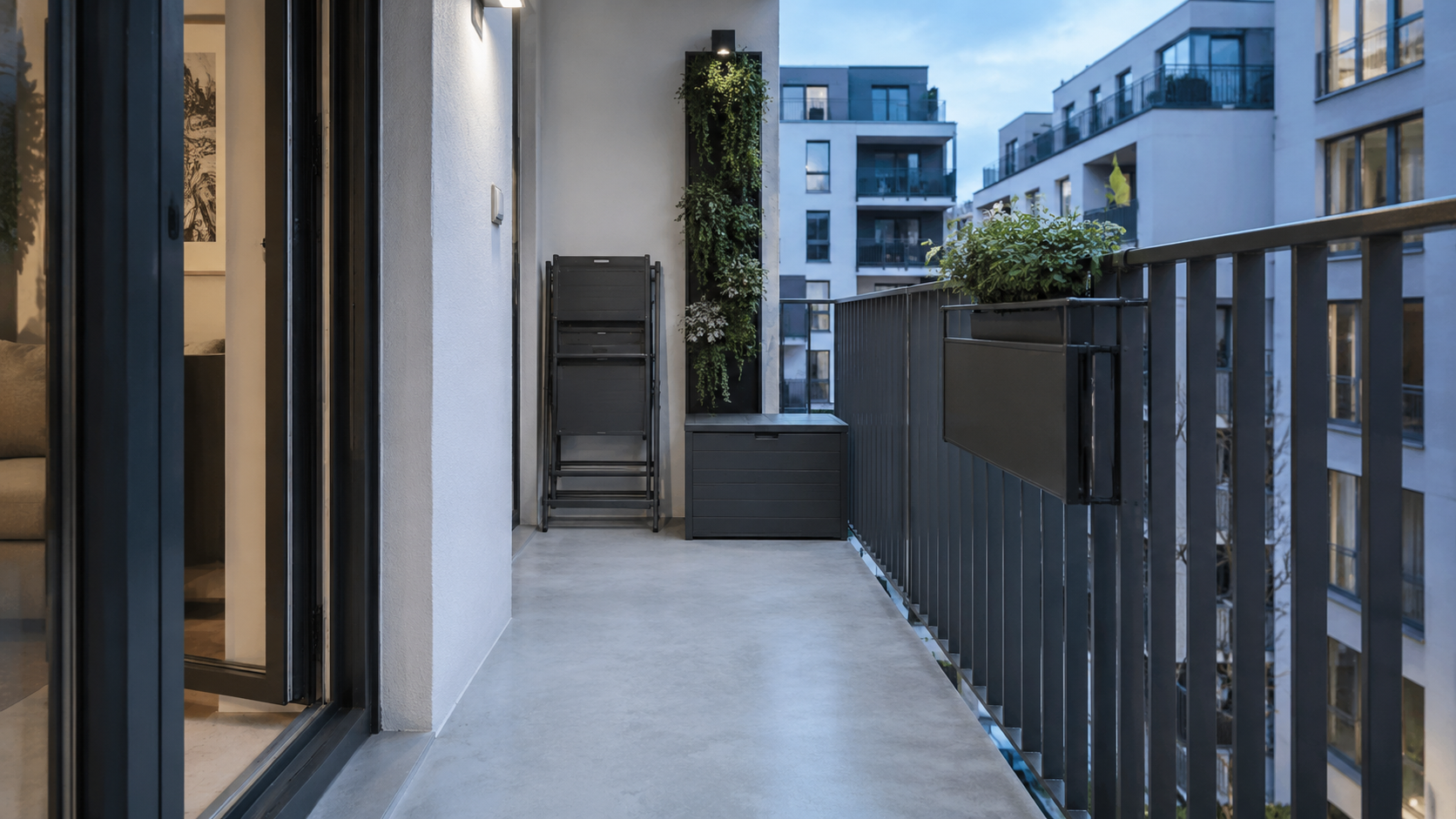 Small Balcony Solutions - Ravnora Decor Small balcony reset after use with furniture folded away, storage closed and the central floor clear.