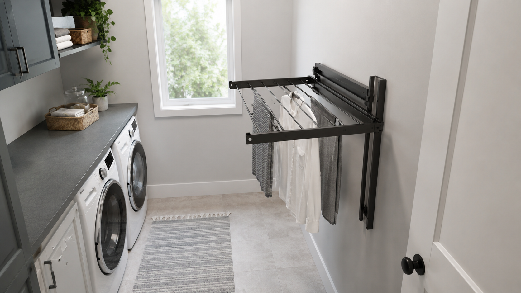 Laundry Wall Organization - Ravnora Decor Fold-out laundry wall hardware in its working position with appliance access and walking clearance visible.