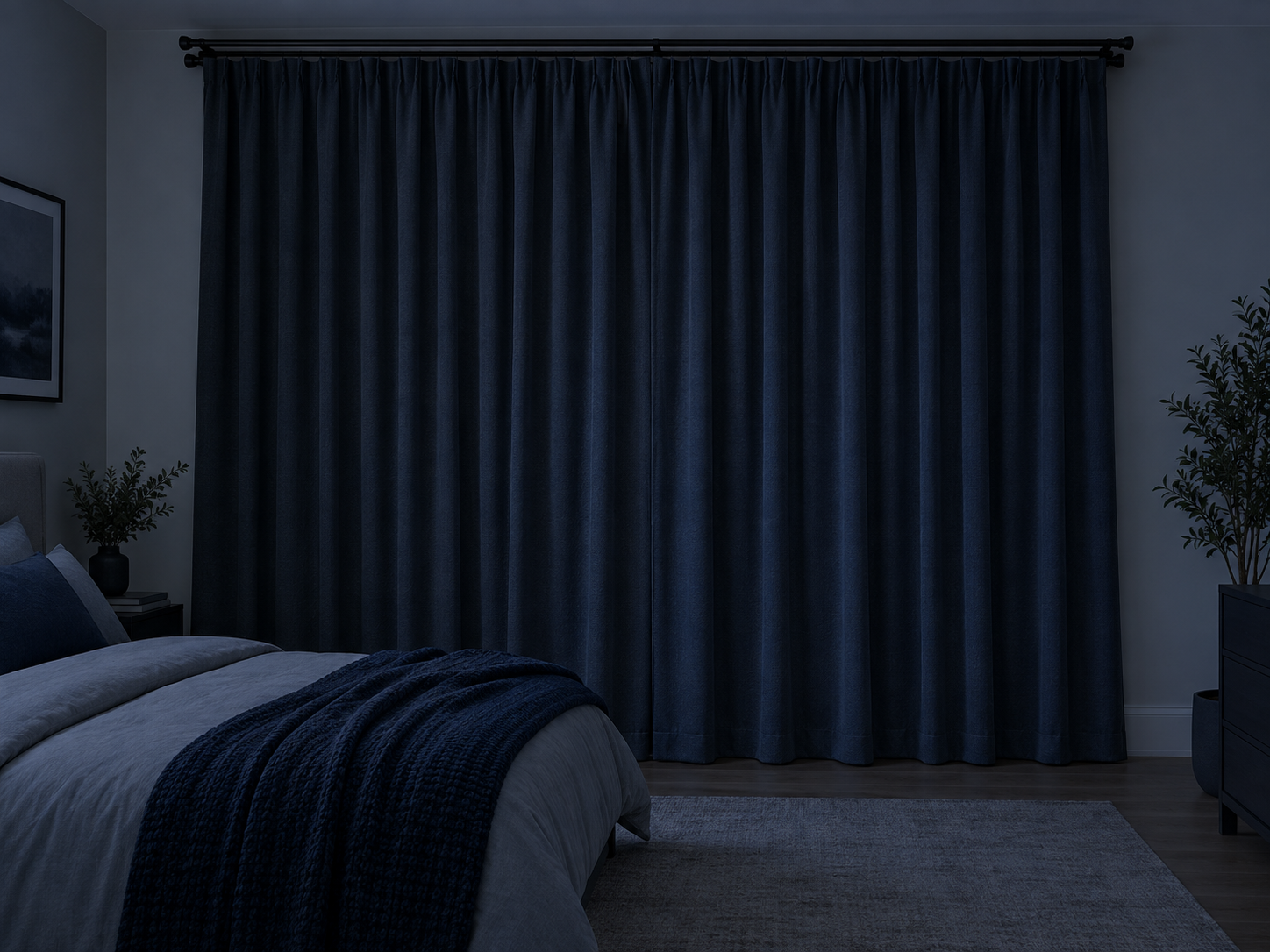 Dark modern bedroom with full-length blackout curtains closed across the window.