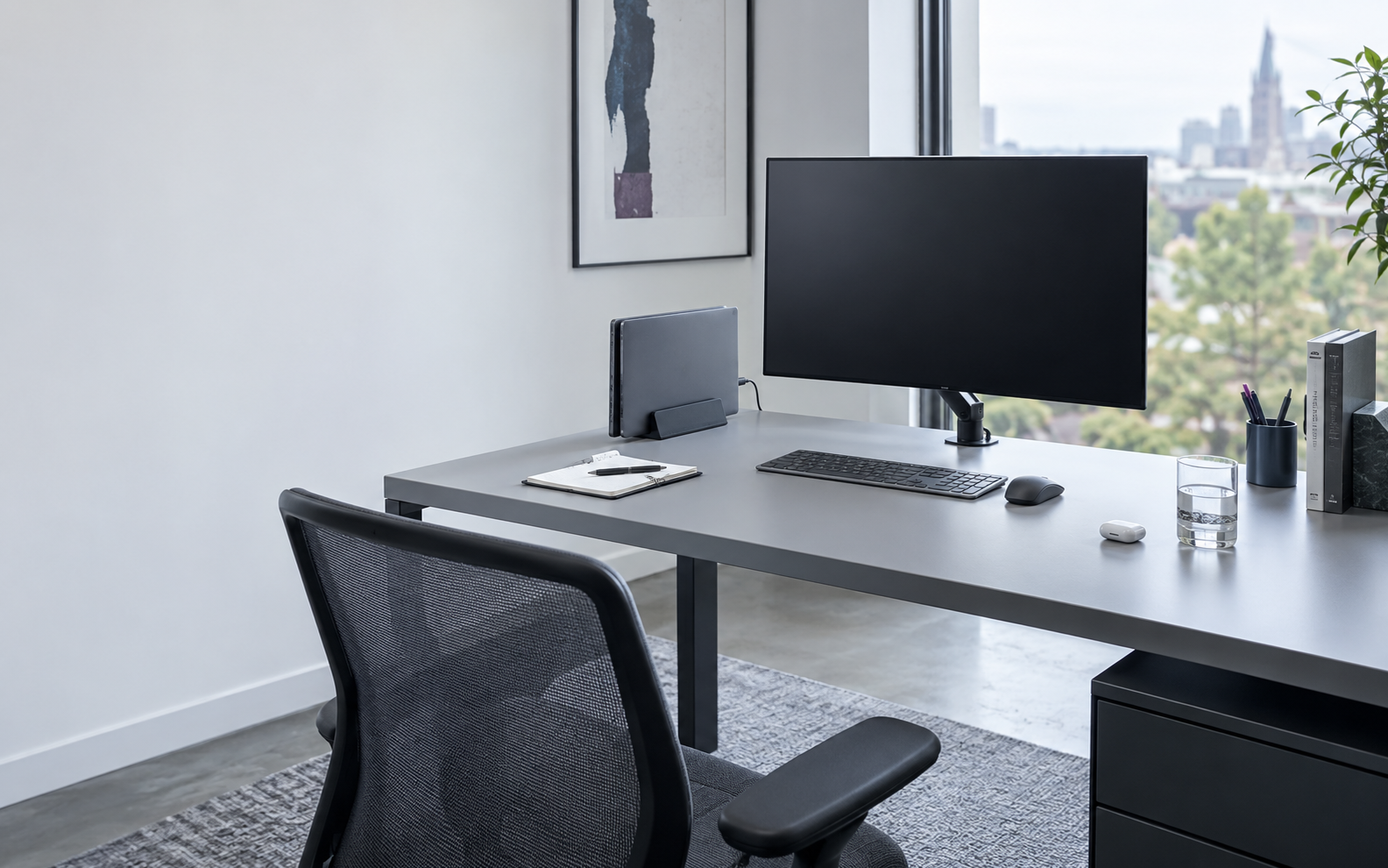 Home Office Desk Accessories - Ravnora Decor Modern home office desk with an elevated monitor, vertically parked laptop, controlled cable route and a clear central working area.