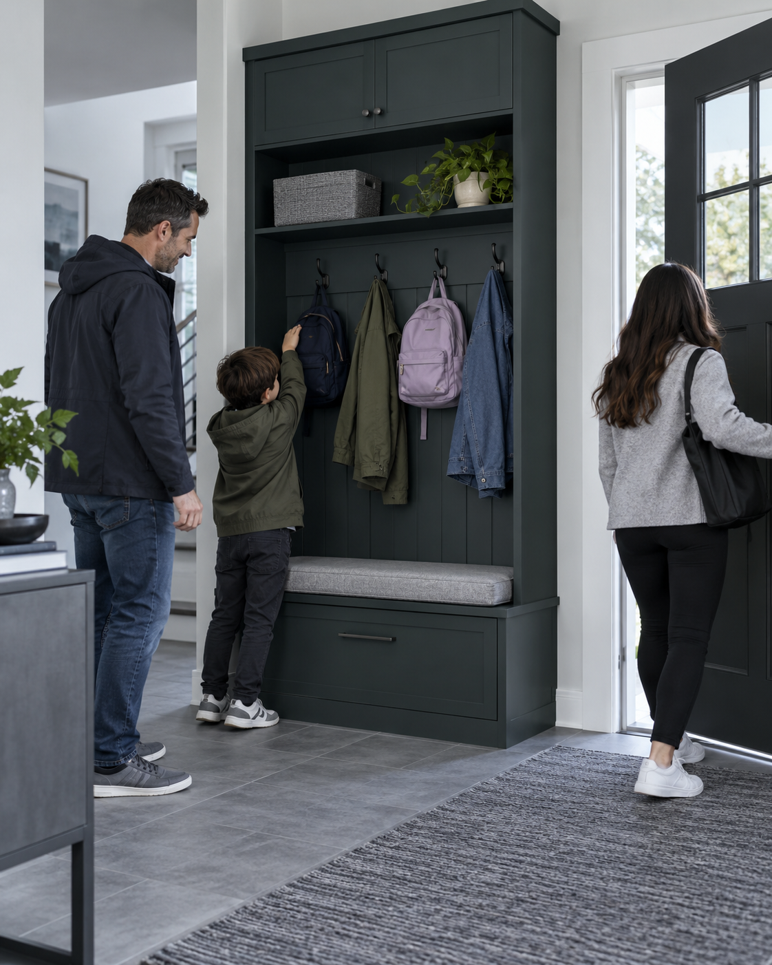 Entryway Furniture - Ravnora Decor Family entryway with an integrated dark hall tree, bench, closed lower storage and hooks for coats and backpacks.