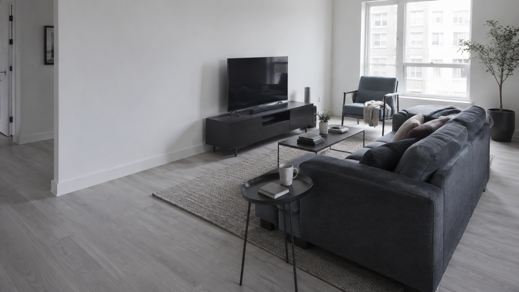 Living Room Furniture - Ravnora Decor Contemporary living room where a large sofa, secondary chair, and central table compete for floor space and circulation
