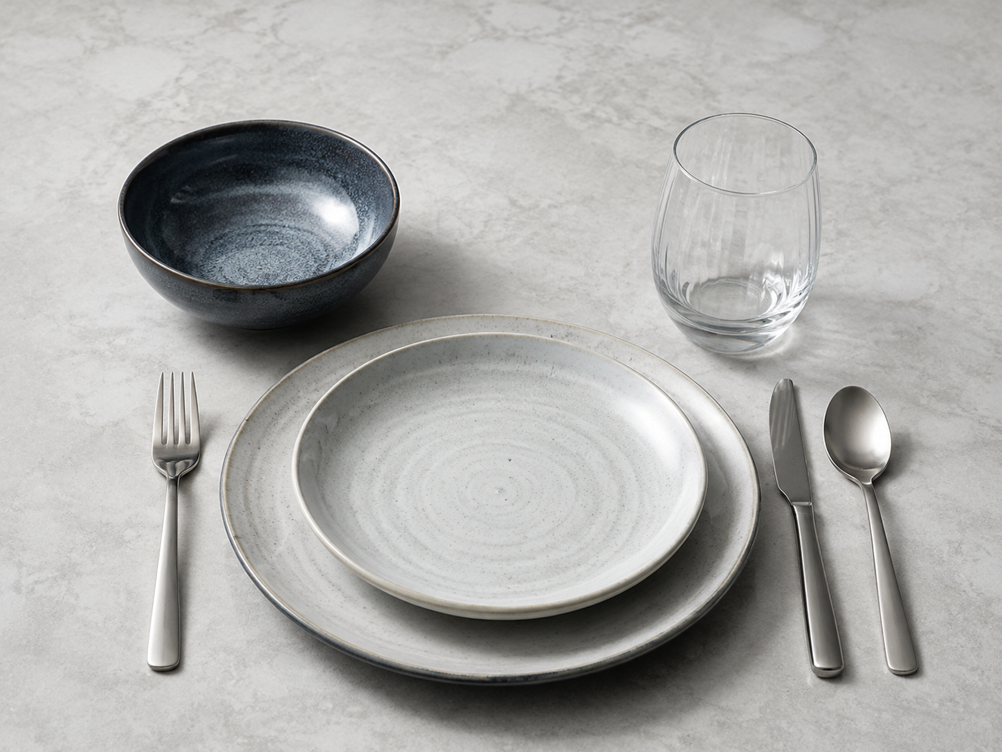 Kitchen Dinnerware & Serveware - Ravnora Decor Modern place setting showing the relationship between plate, bowl, glass and flatware as one coordinated seat.