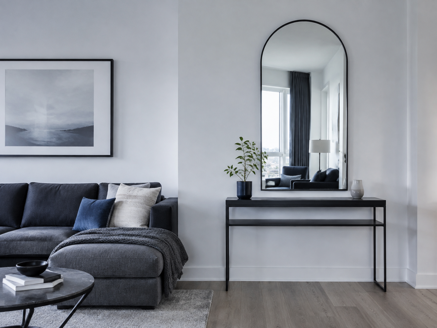 Living Room Wall Decor - Ravnora Decor Arched mirror creating a lighter vertical focal point in a modern living room