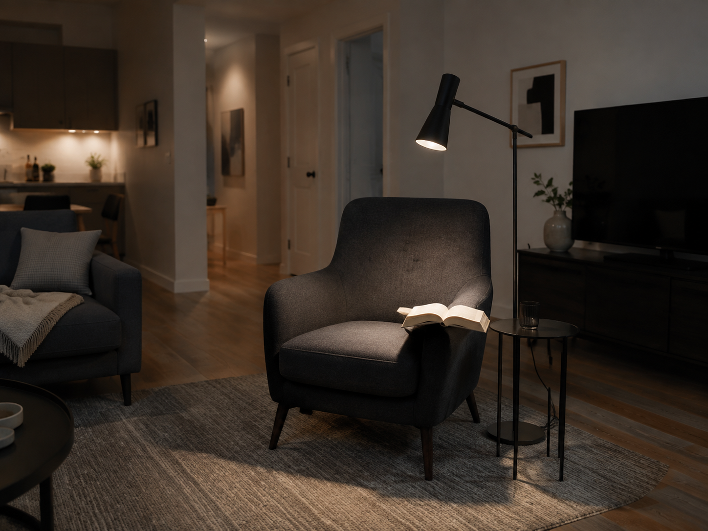 Living room in reading mode with focused task light at the chair and low background illumination.