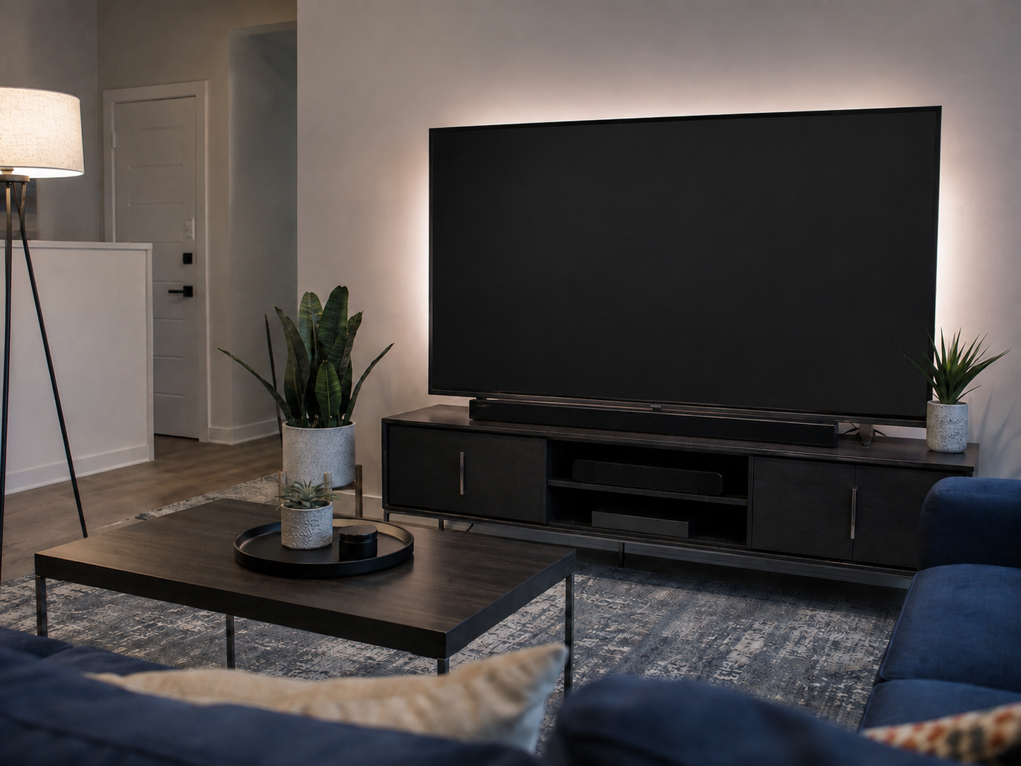 Living-room TV with side and backlighting positioned to reduce visible screen glare.