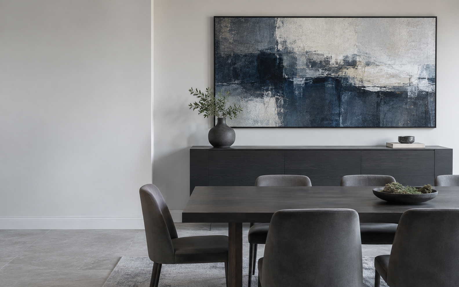 Contemporary dining room with correctly scaled blue-gray abstract artwork above a dark sideboard